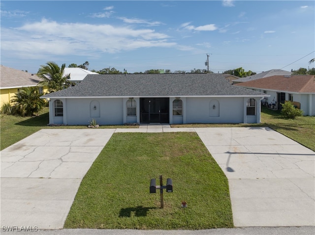 ranch-style home featuring stucco siding, concrete driveway, a front lawn, and a shingled roof