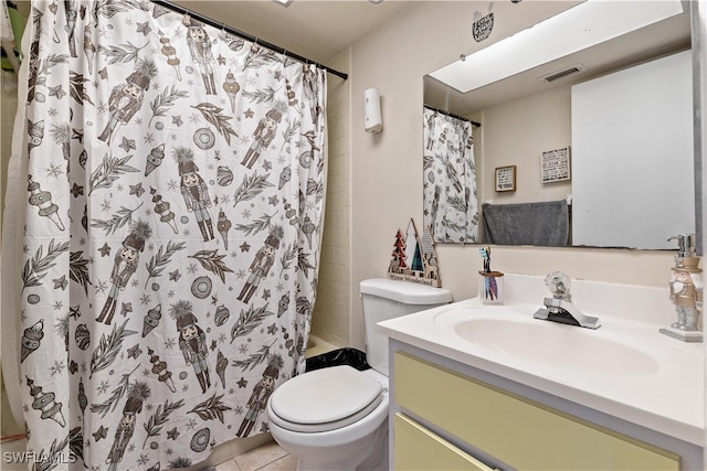 full bathroom featuring toilet, vanity, tile patterned floors, and shower / bathtub combination with curtain