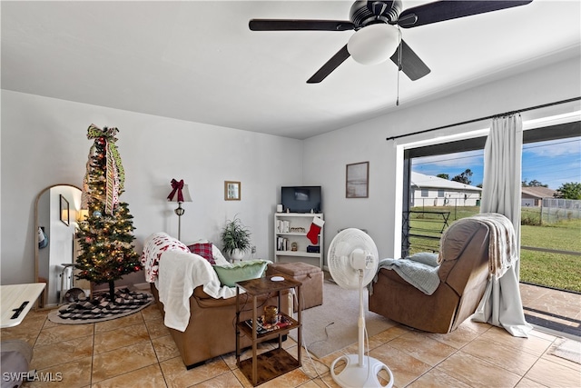 tiled living room with ceiling fan