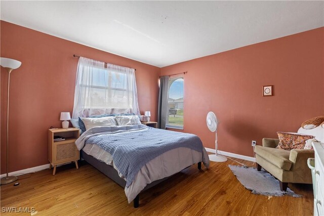 bedroom with hardwood / wood-style floors