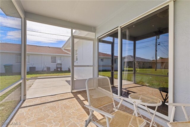 sunroom / solarium featuring a healthy amount of sunlight