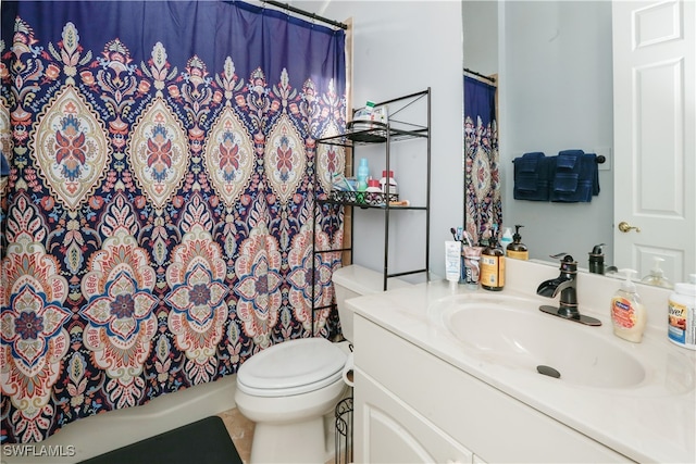 bathroom featuring a shower with curtain, tile patterned flooring, vanity, and toilet