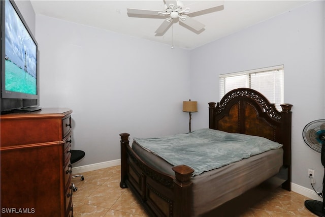 tiled bedroom with ceiling fan