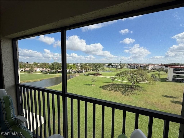 balcony featuring a water view