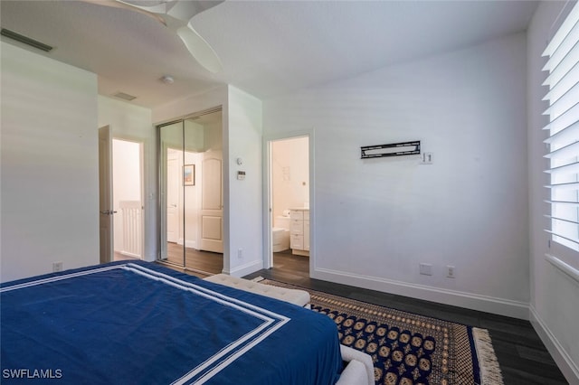 bedroom featuring dark hardwood / wood-style flooring, ceiling fan, and a closet