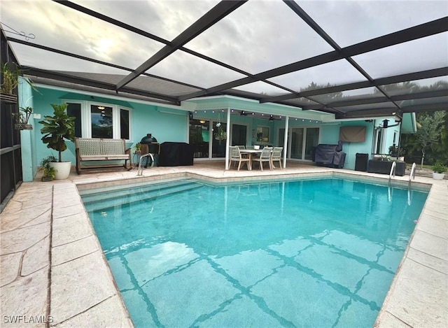 view of swimming pool with a patio area, a lanai, and an outdoor hangout area