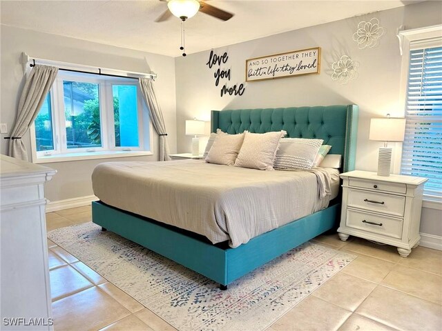 tiled bedroom with ceiling fan