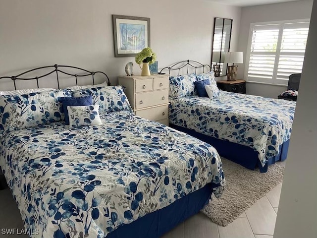 bedroom featuring tile patterned flooring