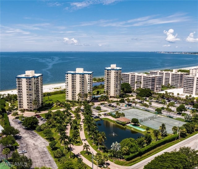 birds eye view of property featuring a water view and a view of the beach