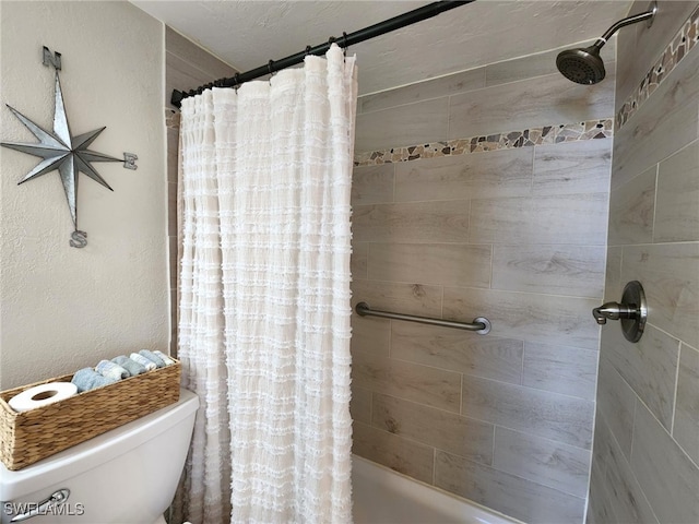 bathroom with toilet and shower / bath combo with shower curtain