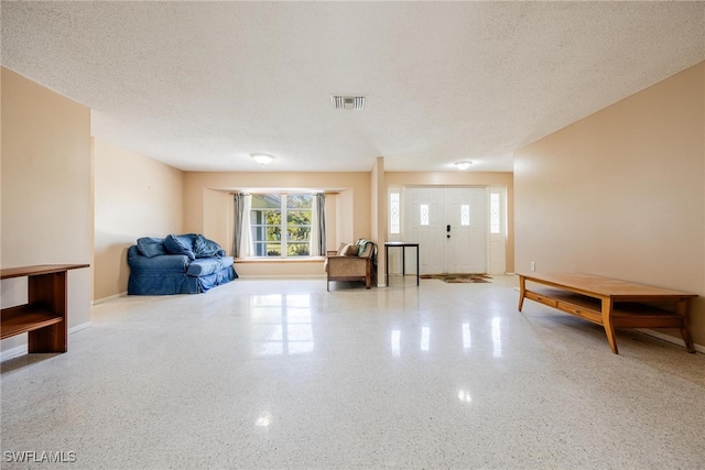 interior space with a textured ceiling