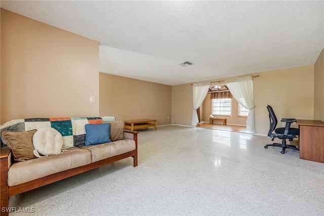 office area with a textured ceiling