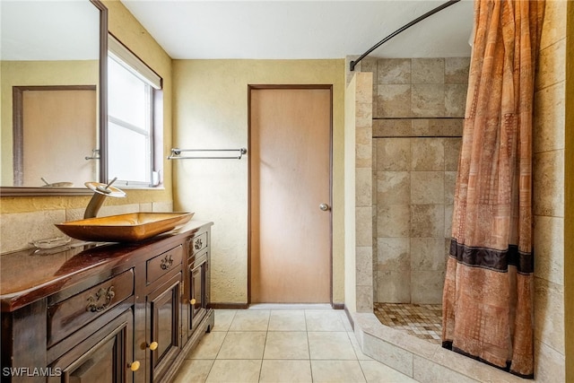 bathroom featuring tile patterned floors, vanity, and a shower with shower curtain