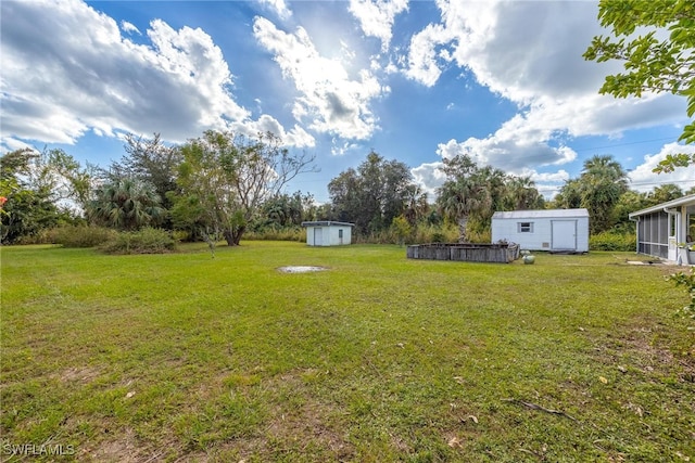 view of yard with a storage unit