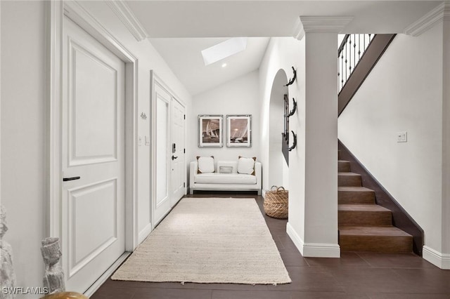 5908 Via Lugano, Naples, FL 34108 - corridor with a skylight, stairs, lofted ceiling, baseboards, and dark tile patterned floors