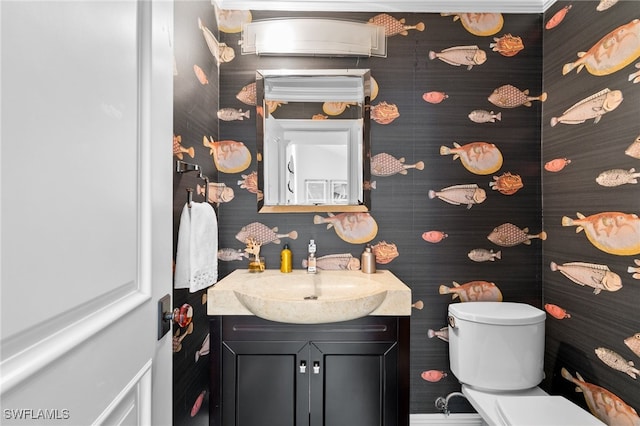 bathroom with vanity and toilet