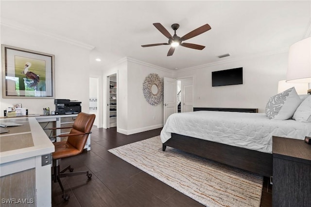 5908 Via Lugano, Naples, FL 34108 - bedroom with a desk, ornamental molding, a walk in closet, dark wood finished floors, and baseboards