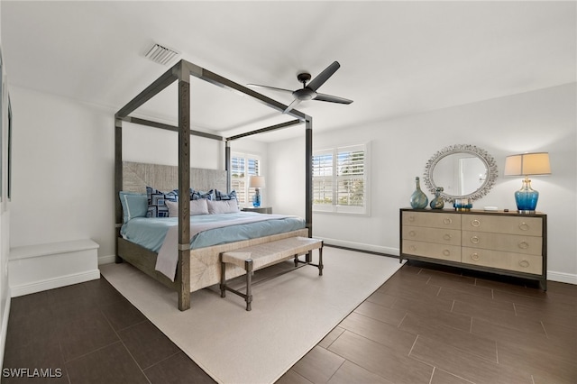 bedroom featuring ceiling fan and dark wood-type flooring