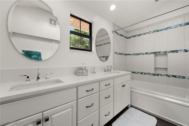 5908 Via Lugano, Naples, FL 34108 - bathroom featuring shower / washtub combination, double vanity, vaulted ceiling, and recessed lighting