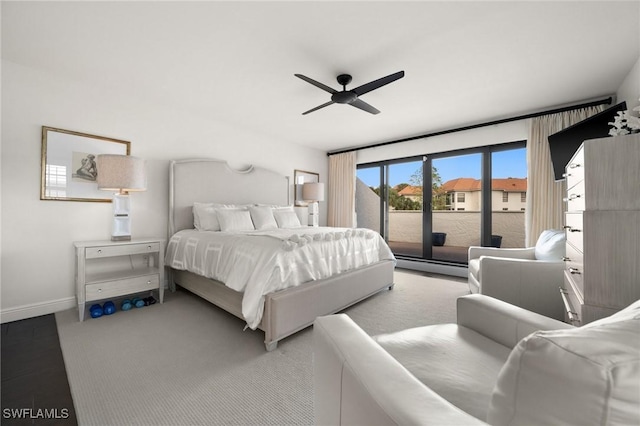 5908 Via Lugano, Naples, FL 34108 - carpeted bedroom featuring access to outside, a baseboard heating unit, baseboards, and a ceiling fan