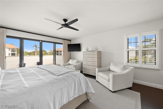 bedroom with access to exterior, hardwood / wood-style flooring, and ceiling fan