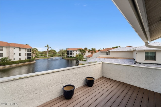 deck featuring a water view