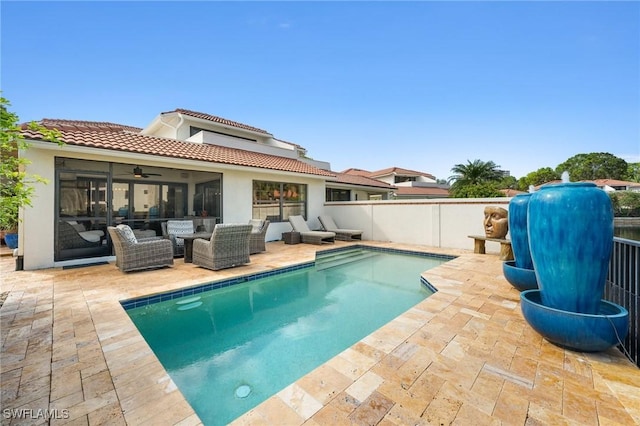 5908 Via Lugano, Naples, FL 34108 - view of swimming pool featuring ceiling fan, a patio, and an outdoor living space