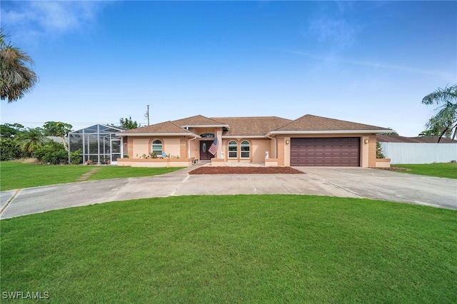 view of front of property featuring a garage, a front lawn, and a lanai