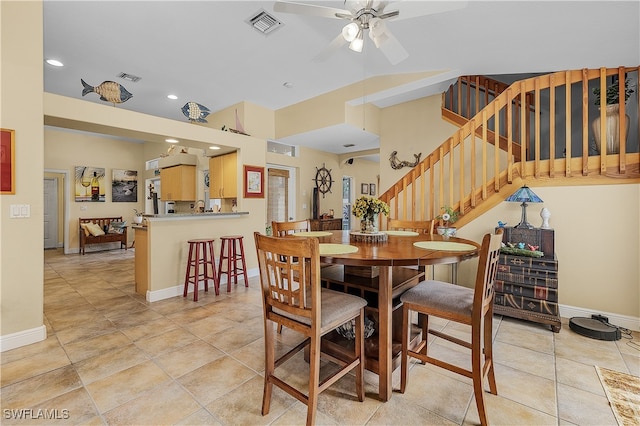 tiled dining room with ceiling fan