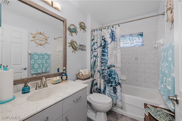 full bathroom featuring toilet, vanity, tile patterned floors, and shower / bath combo with shower curtain