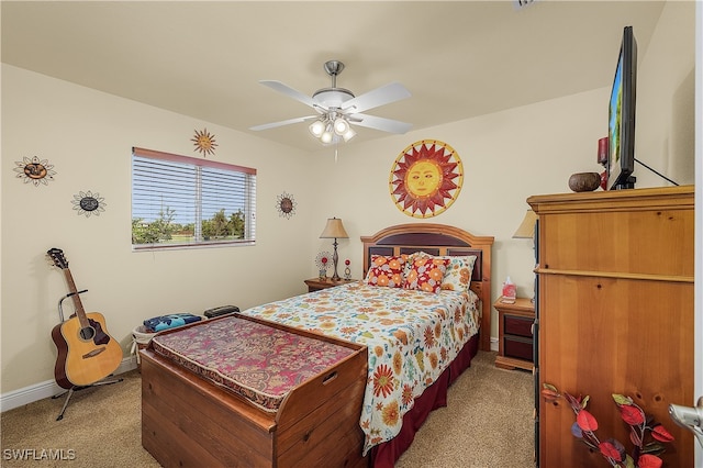 bedroom with light carpet and ceiling fan