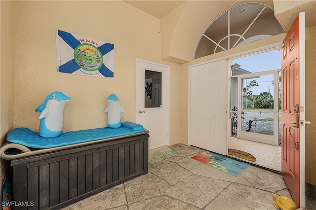 entryway with stone tile floors