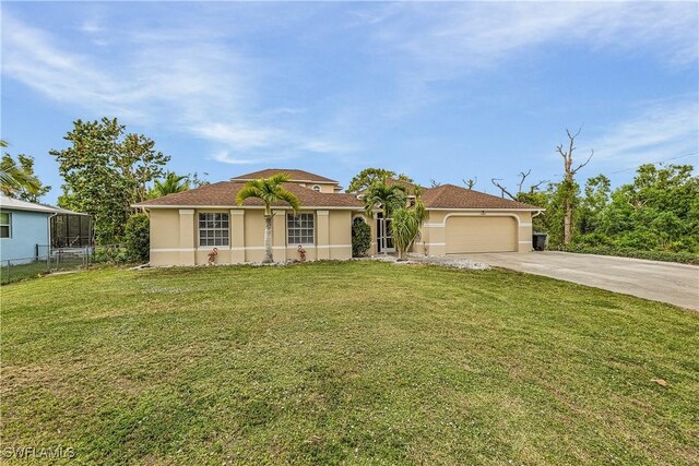 view of front facade with a front yard and a garage