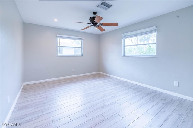 unfurnished room with ceiling fan and light hardwood / wood-style floors