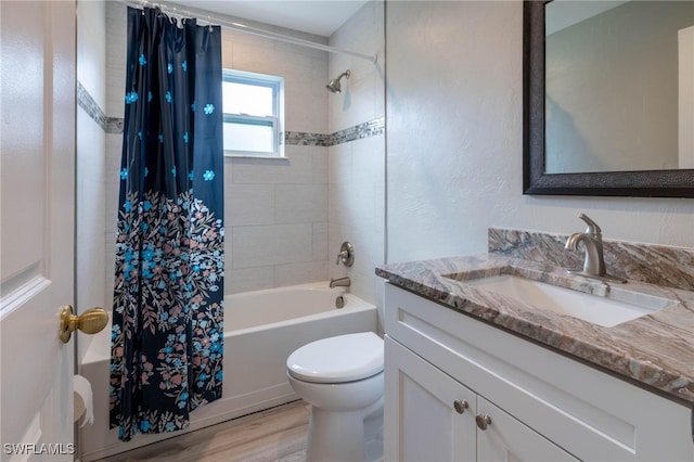 full bathroom featuring shower / bath combo with shower curtain, toilet, wood-type flooring, and vanity