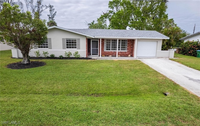 single story home with a front yard and a garage