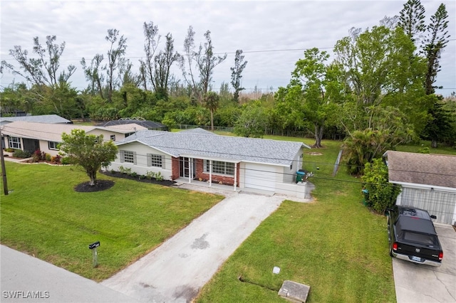 single story home with a front yard and a garage