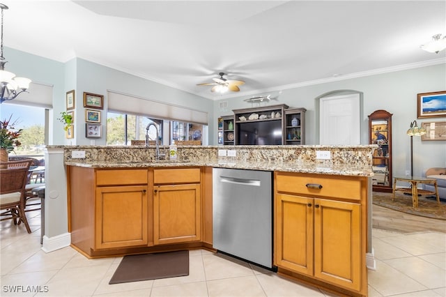 kitchen with sink, light stone counters, ornamental molding, pendant lighting, and ceiling fan with notable chandelier