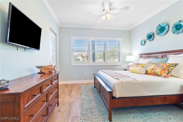 bedroom with crown molding, ceiling fan, and light wood-type flooring