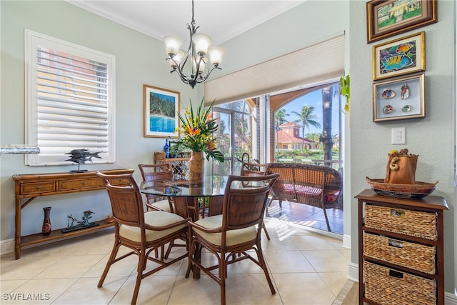 tiled dining room featuring an inviting chandelier and crown molding