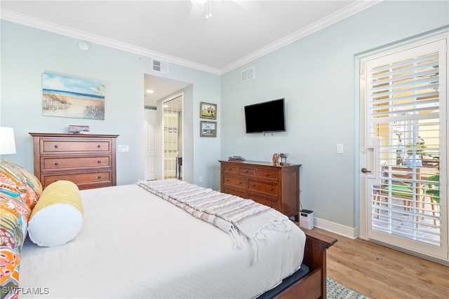 bedroom featuring ensuite bathroom, crown molding, access to outside, light wood-type flooring, and ceiling fan