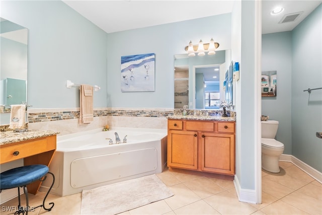 full bathroom with tile patterned flooring, vanity, shower with separate bathtub, and toilet