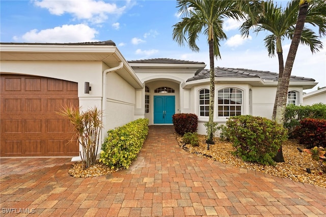 property entrance with a garage