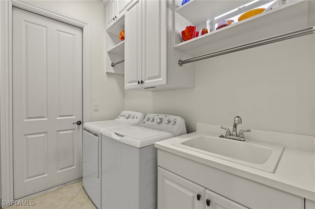12656 Grandezza Cir, Estero, FL 33928 - laundry room with cabinet space, separate washer and dryer, and light tile patterned floors