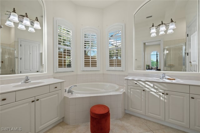 bathroom with vanity, tile patterned flooring, and plus walk in shower