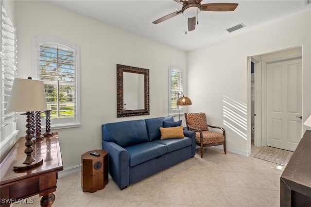 12656 Grandezza Cir, Estero, FL 33928 - sitting room with healthy amount of natural light, ceiling fan, and light tile patterned flooring
