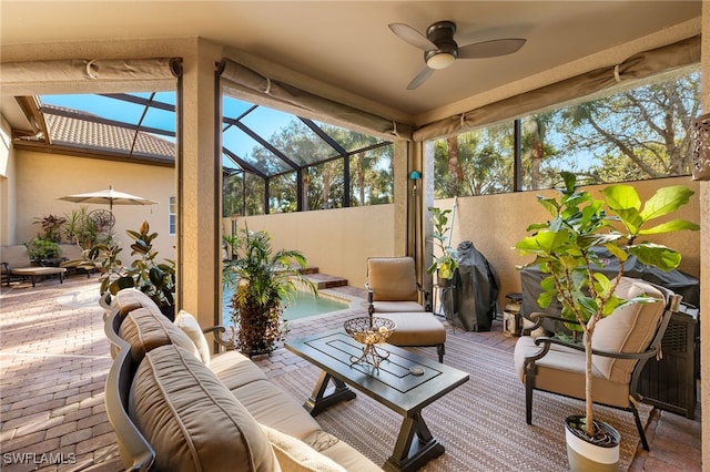 12656 Grandezza Cir, Estero, FL 33928 - sunroom with a ceiling fan and outdoor lounge area
