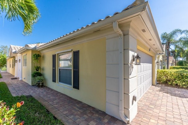 view of property exterior with a garage