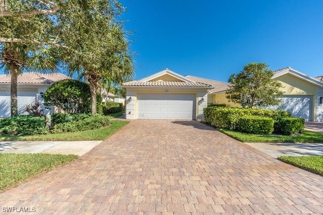 view of front of property with a garage