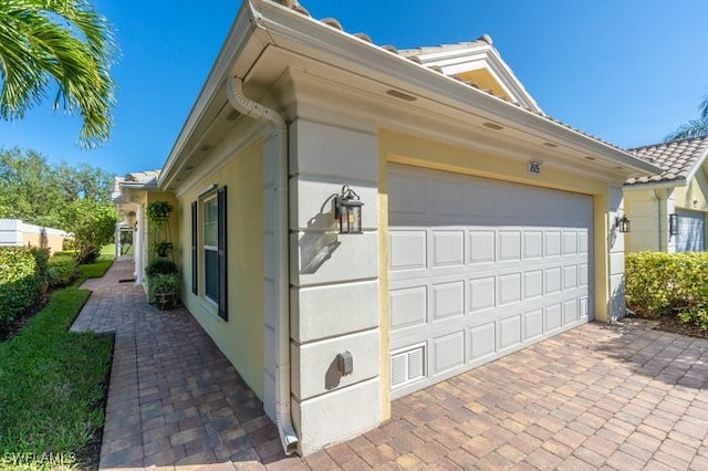 view of property exterior featuring a garage